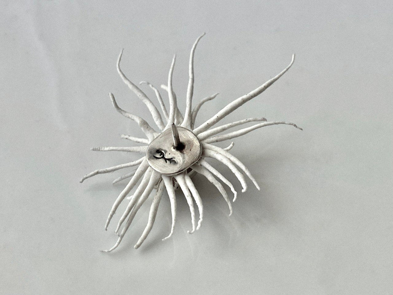 memento mori sun brooch