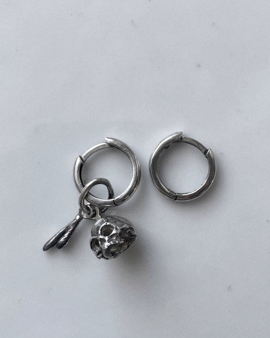 hoop earrings with a skull charm 💀