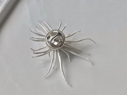memento mori sun brooch